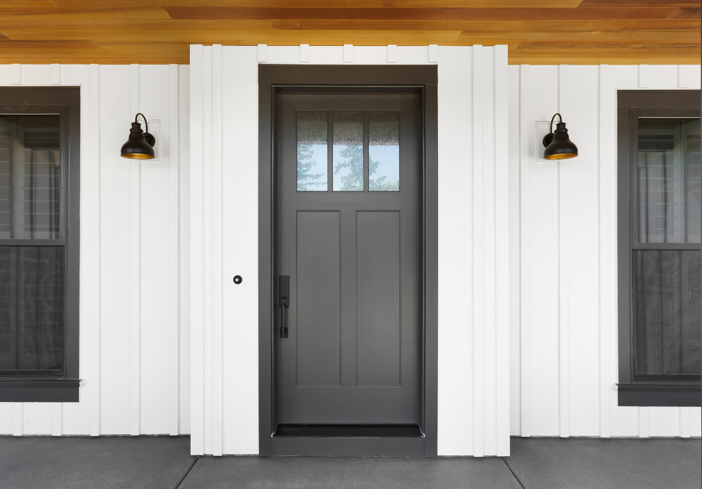 premium entry doors Stylish Dark Entry Door on a Farmhouse Style Home