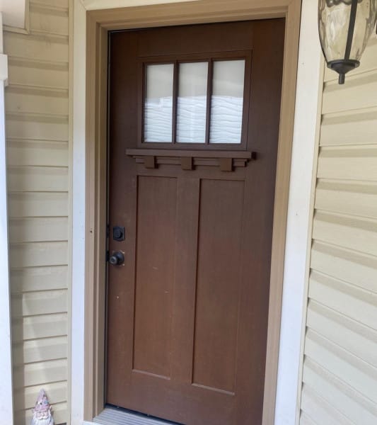 Old leaky entry door deteriorated and in need of replacing diagnosed by Kelly Window and Door