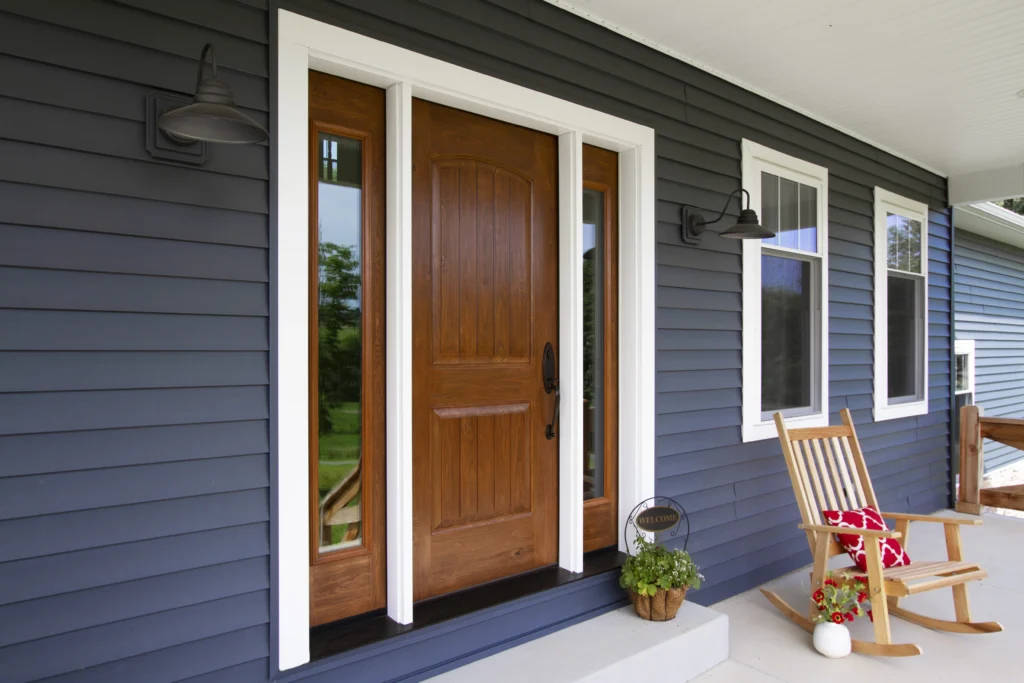 beautiful new wood door and white window replacement for holly springs home