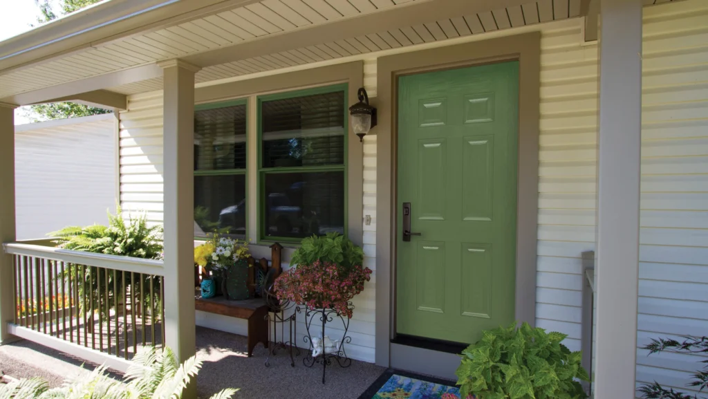 beautiful green entry door and new window in morrisville nc by kelly window and door