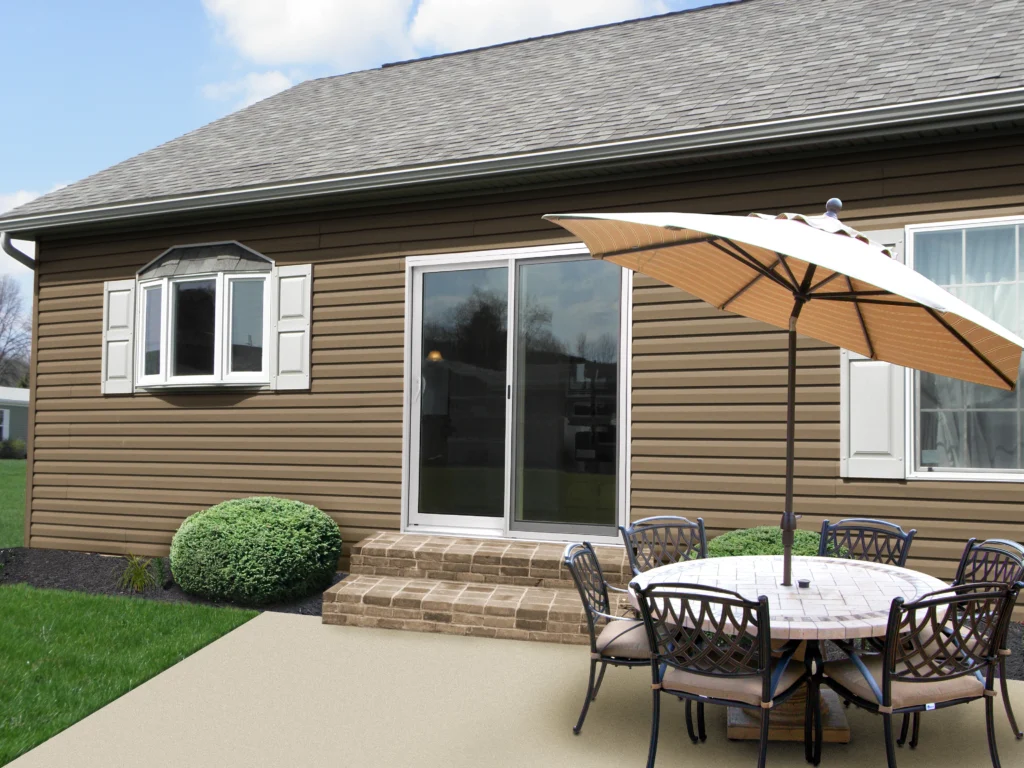 sliding glass patio door on brown raleigh nc home. patio door replacement is white and modern