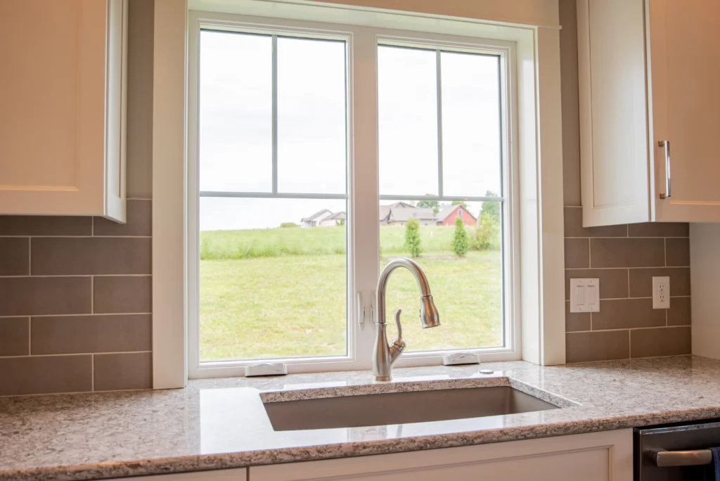 new high quality vinyl window installation in cary nc home. white window above sink