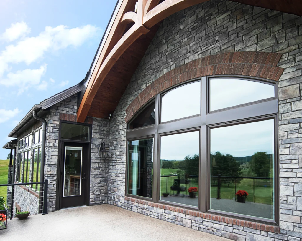 half round wood window replacementon raleigh nc home. beautiful large wood window on stone home